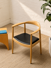 Load image into Gallery viewer, Modern Sculptural Oak Horseshoe Armchair with Black Seat

