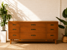 Load image into Gallery viewer, Vintage Red Lion Furniture Co. mid-century nine-drawer wood dresser with recessed brass-tone pulls and elevated stretcher base.
