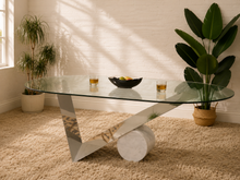 Load image into Gallery viewer, Postmodern oval glass dining table with sculptural intersecting chrome base and cylindrical white marble support.
