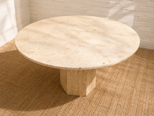 Load image into Gallery viewer, Vintage round cream marble dining  table with substantial geometric pedestal base and natural stone veining.
