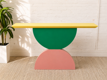 Load image into Gallery viewer, Colorful postmodern console table with yellow top, green semicircle center and pink sculptural base
