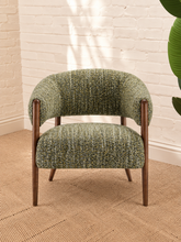 Load image into Gallery viewer, Abby accent chair upholstered in textured sage amber bouclé with curved wraparound backrest, cushioned seat and exposed brown wood legs.
