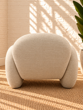 Load image into Gallery viewer, Adriana ivory chenille accent chair with rounded wraparound back, curved upholstered arms, plush seat cushion, and sculptural silhouette.
