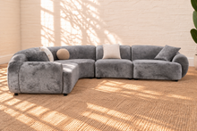 Load image into Gallery viewer, Aela curved sectional sofa upholstered in textured ash grey fabric with rounded corners, square arms, tight back, and five toss pillows.
