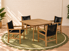 Load image into Gallery viewer, Alessia warm teak outdoor dining table with four black woven rope armchairs
