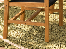 Load image into Gallery viewer, Alessia warm teak outdoor dining table with four black woven rope armchairs
