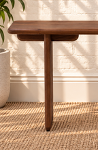 Load image into Gallery viewer, Alijah sculptural desk in natural brown mindi wood with rounded rectangular top, asymmetrical slab legs, and curved under-top supports.
