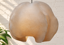Load image into Gallery viewer, Alora hanging lamp in oyster resin with overlapping organic panels, softly undulating edges, textured surface, and dark cord suspension.
