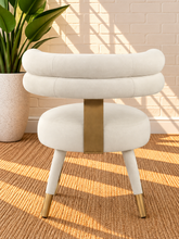 Load image into Gallery viewer, Althea Pearl Cream velvet dining chair with deep channel tufted back and gold metal leg details
