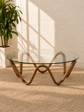 Load image into Gallery viewer, Amalia round glass coffee table with sculptural sinuous walnut wave base and metal glass supports.
