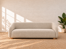 Load image into Gallery viewer, Image 2 of 6: Amara 85-inch upholstered sofa in Greige chenille with curved back, rounded arms, ball accent pillows, and wood bun feet
