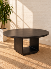 Load image into Gallery viewer, Image 1 of 4: Ansel 60-inch round dining table in Charcoal with burnished black finish and sculptural open pedestal base

