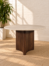 Load image into Gallery viewer, Archie 48-inch round dining table with genuine beige travertine top and solid mango wood pedestal in a rich natural brown walnut finish.

