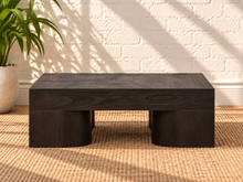 Load image into Gallery viewer, Arnold square coffee table in natural dark brown mindi wood veneer with a thick tabletop and sculptural curved supports.
