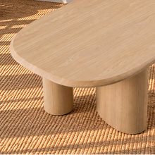 Load image into Gallery viewer, Arya natural ash veneer oval dining table with rounded edges and sculptural triple pedestal legs.
