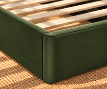 Load image into Gallery viewer, Astrid King-size bed in Olive Green performance velvet with sculptural arched headboard and streamlined plinth base.
