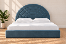 Load image into Gallery viewer, Astrid King-size bed in Slate Blue performance velvet with sculptural arched headboard and streamlined plinth base.
