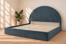 Load image into Gallery viewer, Astrid King-size bed in Slate Blue performance velvet with sculptural arched headboard and streamlined plinth base.
