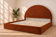 Load image into Gallery viewer, Astrid King-size bed in Terracotta performance velvet with sculptural arched headboard and streamlined plinth base.
