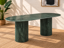Load image into Gallery viewer, Atley oval dining table in Forest Green Verde genuine marble with two fluted cylindrical marble bases and natural stone veining.
