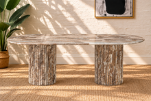 Load image into Gallery viewer, Atley oval dining table in Taupe genuine marble with fluted cylindrical bases and natural stone veining.
