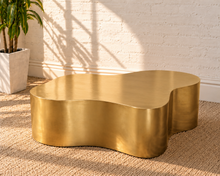 Load image into Gallery viewer, Aurelia abstract coffee table in an Aurum brushed gold metal finish with a sculptural freeform shape and softly curved edges.
