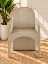 Load image into Gallery viewer, Bailey upholstered dining chair in Champagne Sand velvet with curved arms and sculptural contemporary frame
