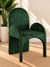 Load image into Gallery viewer, Bailey upholstered dining chair in Forest Emerald velvet with curved arms and sculptural contemporary frame
