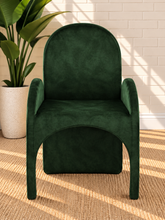 Load image into Gallery viewer, Bailey upholstered dining chair in Forest Emerald velvet with curved arms and sculptural contemporary frame
