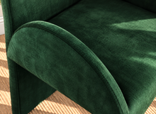 Load image into Gallery viewer, Bailey upholstered dining chair in Forest Emerald velvet with curved arms and sculptural contemporary frame
