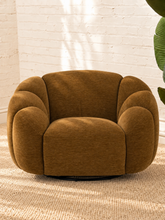 Load image into Gallery viewer, Bellamy camel brown upholstered swivel accent chair with layered rounded arms, tight back and black metal swivel base.
