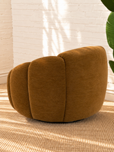 Load image into Gallery viewer, Bellamy camel brown upholstered swivel accent chair with layered rounded arms, tight back and black metal swivel base.

