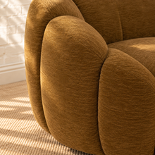 Load image into Gallery viewer, Bellamy camel brown upholstered swivel accent chair with layered rounded arms, tight back and black metal swivel base.
