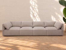 Load image into Gallery viewer, Blaire four piece modular sectional sofa upholstered in cloud gray fabric with four seat cushions, loose back cushions, and softly draped side cushions.
