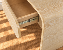 Load image into Gallery viewer, Blaise Blonde Oak nightstand in solid white oak with curved design, integrated drawer, and cerused brushed wood grain.
