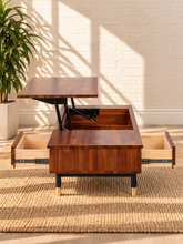 Load image into Gallery viewer, Image 5 of 5: Briar Lift-Top Storage Coffee Table in Warm Walnut with concealed storage, drawer, and black and gold metal legs
