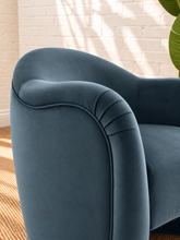 Load image into Gallery viewer, Capri lounge chair in Slate Blue performance velvet with curved barrel back, rounded arms, French piping, and pleated detailing
