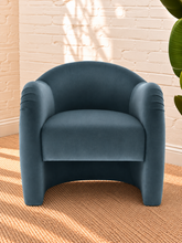 Load image into Gallery viewer, Capri lounge chair in Slate Blue performance velvet with curved barrel back, rounded arms, French piping, and pleated detailing
