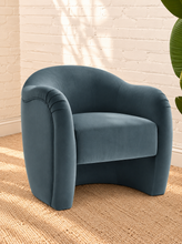Load image into Gallery viewer, Capri lounge chair in Slate Blue performance velvet with curved barrel back, rounded arms, French piping, and pleated detailing
