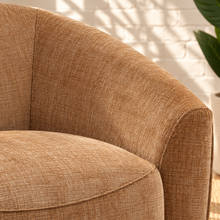 Load image into Gallery viewer, Carter camel chenille swivel accent chair with rounded wraparound back, plush seat cushion, and sculptural upholstered silhouette.
