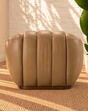Load image into Gallery viewer, Casey honey brown genuine leather accent chair with rounded channel upholstery, curved arms and a slim wood base.
