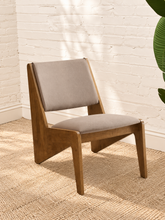 Load image into Gallery viewer, warm brown wood lounge chairs with neutral upholstered seats and angular tapered frames
