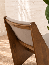Load image into Gallery viewer, Pair of Catalina warm brown wood lounge chairs with neutral upholstered seats and angular tapered frames
