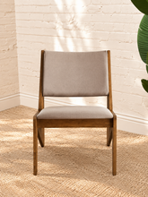 Load image into Gallery viewer, Pair of Catalina warm brown wood lounge chairs with neutral upholstered seats and angular tapered frames

