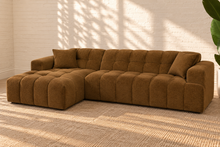 Load image into Gallery viewer, Cayden caramel upholstered L-shaped sectional sofa with left-facing chaise, tufted seat and back, square arms, and two matching throw pillows.
