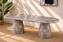 Load image into Gallery viewer, Celine oval dining table in Mocha brown marble finish with two sculptural tapered pedestal bases and rounded tabletop.
