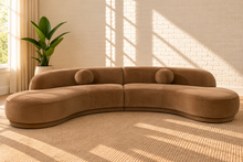 Load image into Gallery viewer, Chance 2-piece modular sectional sofa in Hazelnut Latte Saddle Velvet with sculptural curved seating, rounded back cushions, and circular accent cushions.
