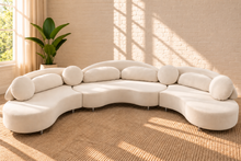 Load image into Gallery viewer, Cianne 3-piece sectional sofa in Creamy White velvet with organic curved seating, rounded pillows, and interchangeable gold or chrome legs.
