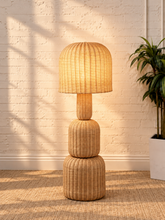 Load image into Gallery viewer, Image 2 of 5: Ciel sculptural floor lamp in natural woven rattan with stacked rounded forms and brass detailing
