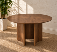 Load image into Gallery viewer, Clara round Warm Chestnut dining table with walnut starburst veneer top and sculptural curved tripod base
